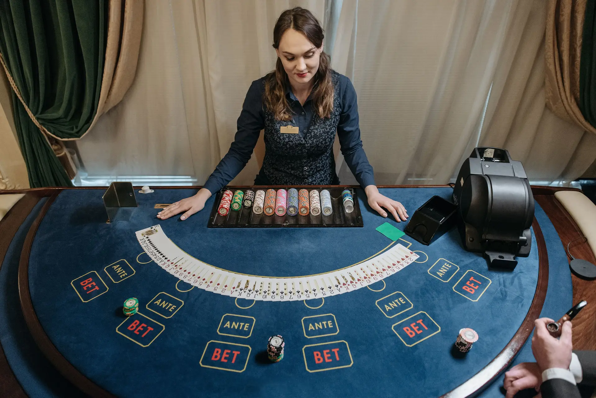 Professional dealer at an elegant table game area